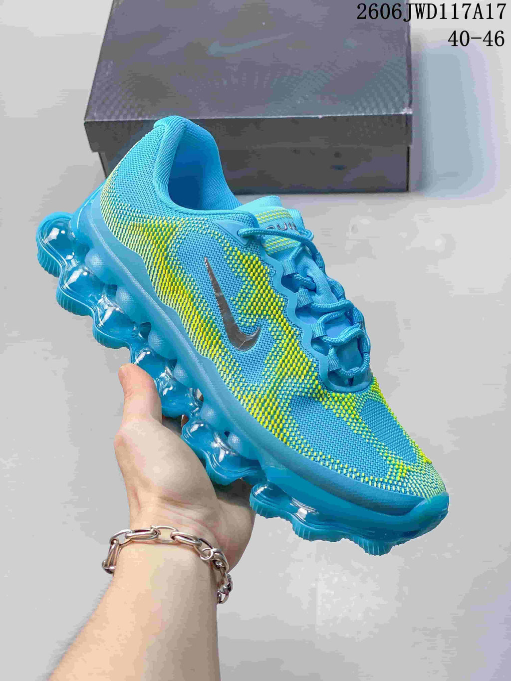 Pink and white Nike Air Liquid Max low-top sneaker with a segmented transparent-looking sole