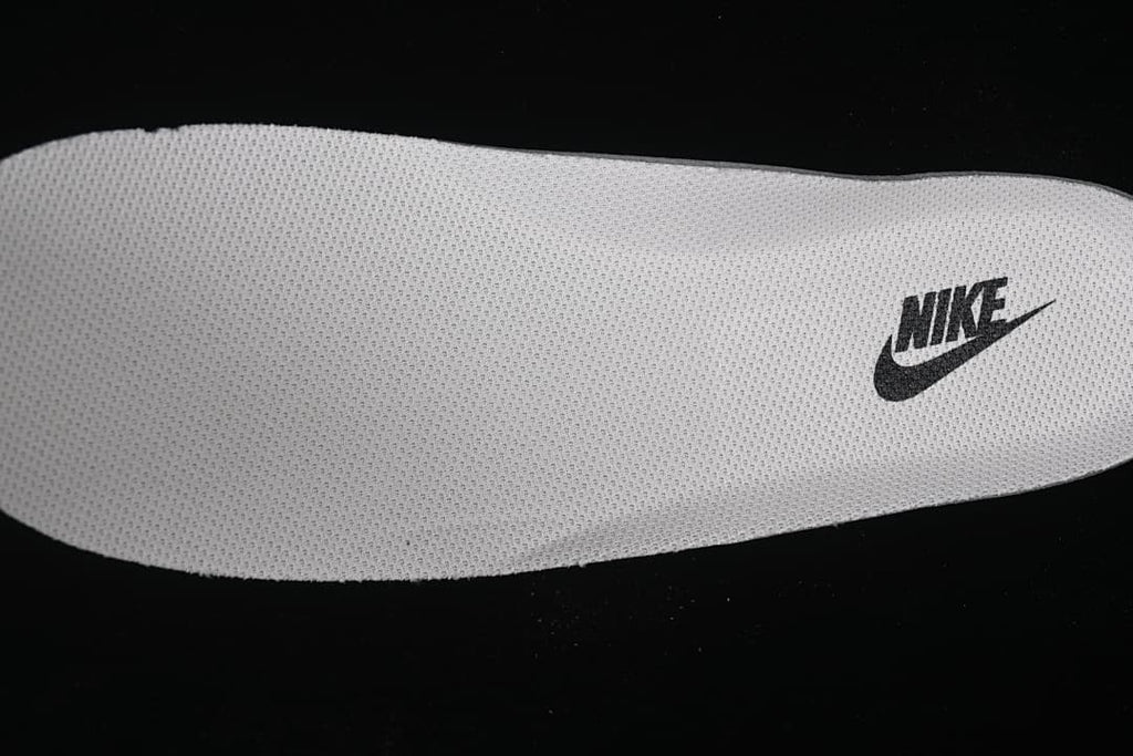 Close-up of a white insole with a Nike logo.