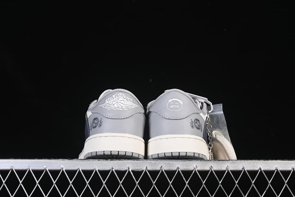 Rear view of the pair showing the heel emblems and gray heel panels.