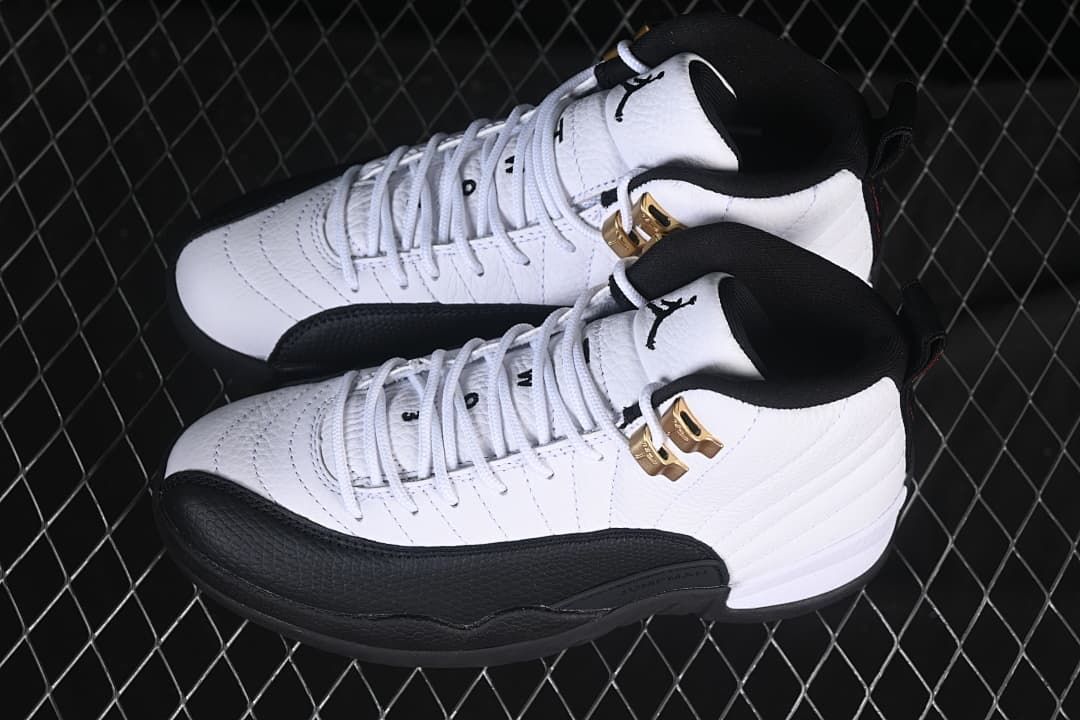 Pair of white and black high-top sneakers photographed from above.