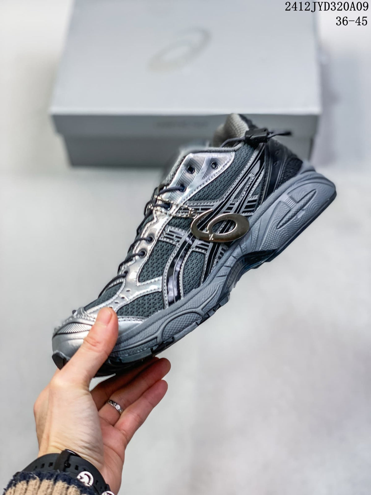 Side view of the gray and silver sneaker