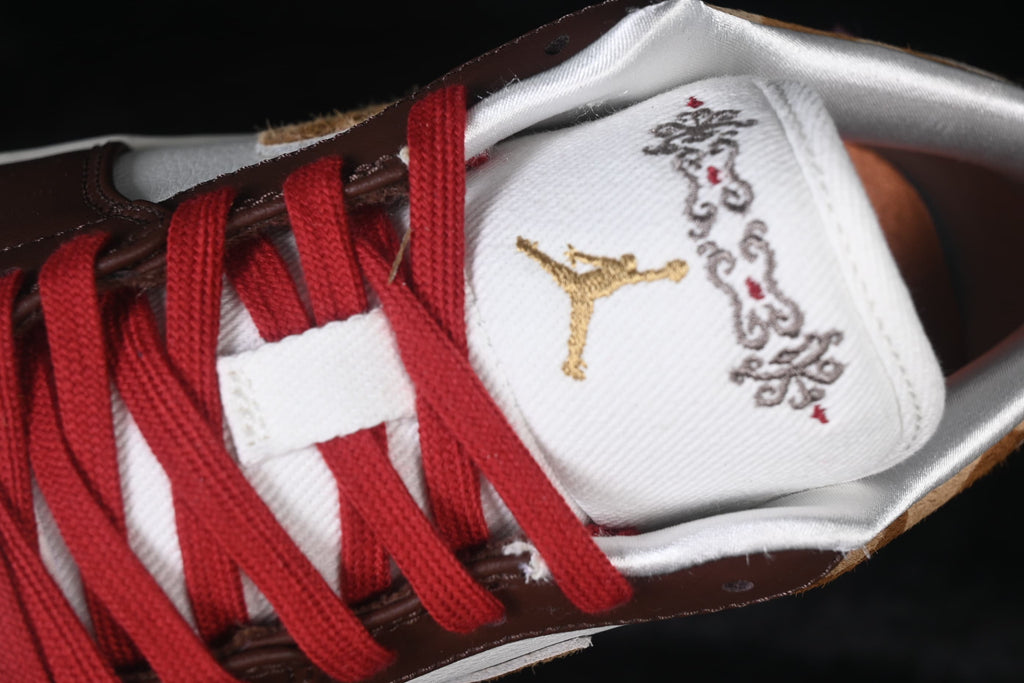 Close-up of the embroidered tongue and red laces