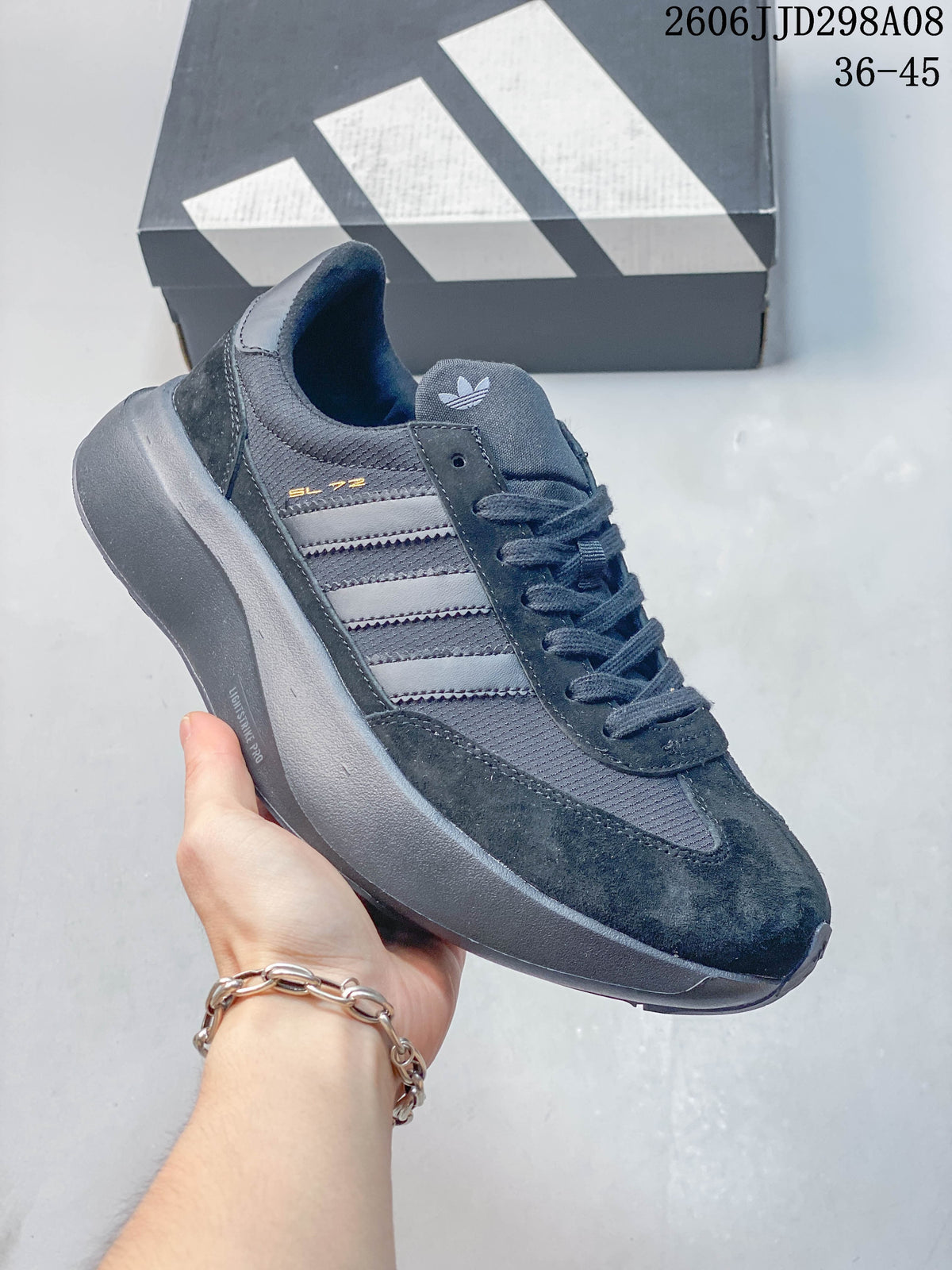 Dark navy adidas SL 72 Pro sneaker with grey stripes and a dark sole