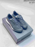 Pair of gray Arc'teryx Konseal LT trail shoes displayed on a shoebox