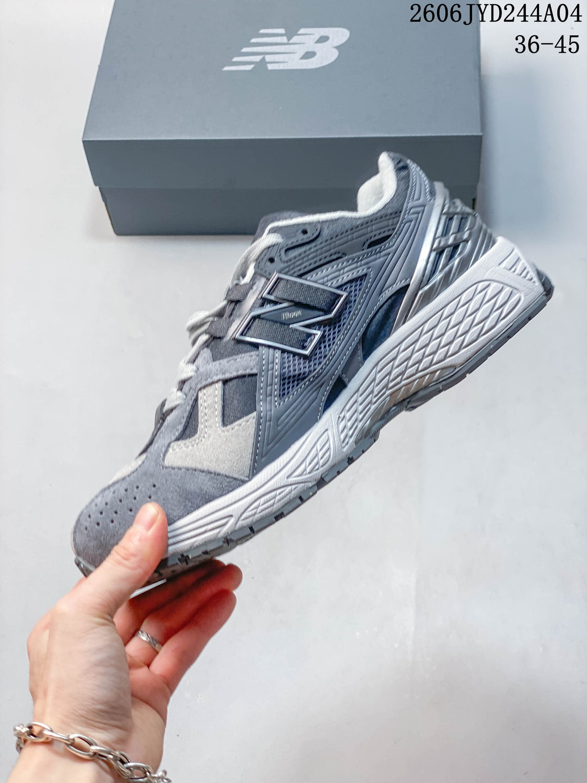 Side profile of a gray New Balance 1906R sneaker