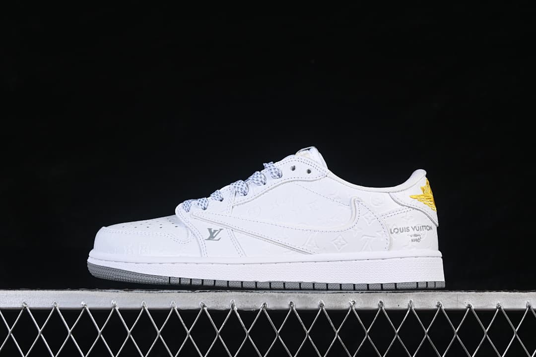 Side view of an off-white low-top sneaker with embossed decorative motifs and a gold-tone heel detail