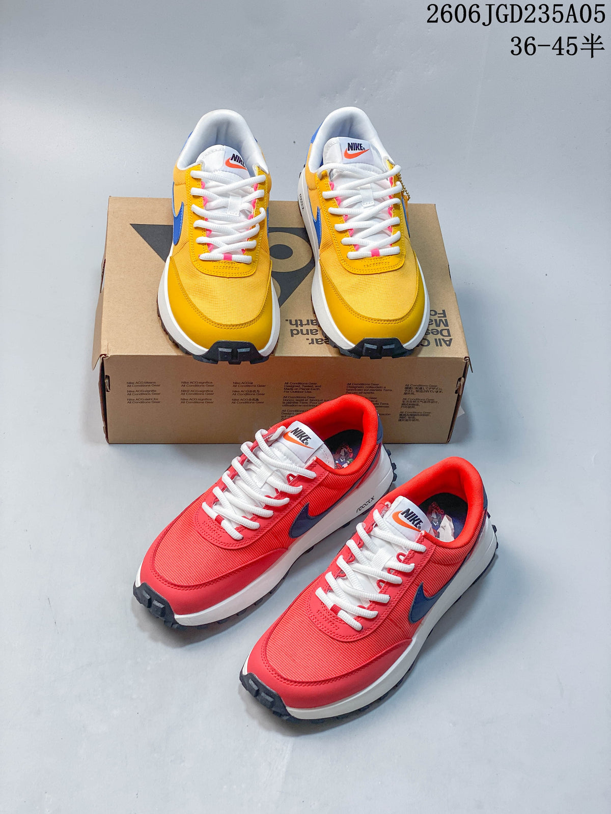 Yellow and red Nike ACG LDV shoes shown together from front and three-quarter angles