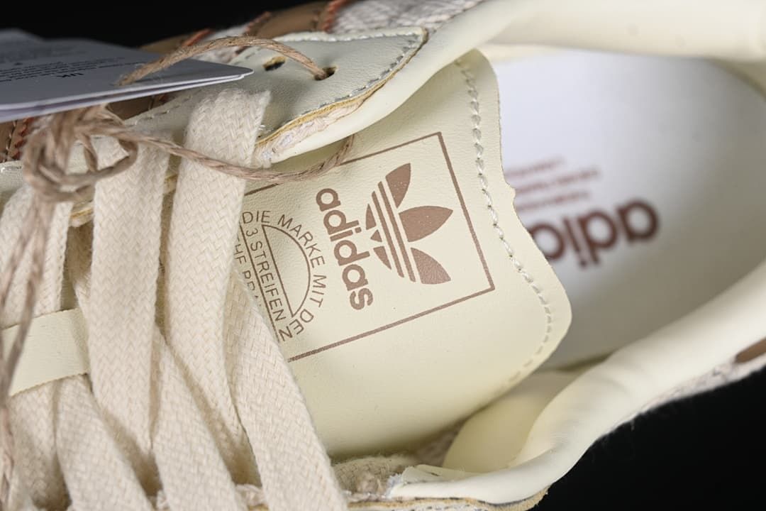 Close-up of the adidas trefoil tongue label and lace area