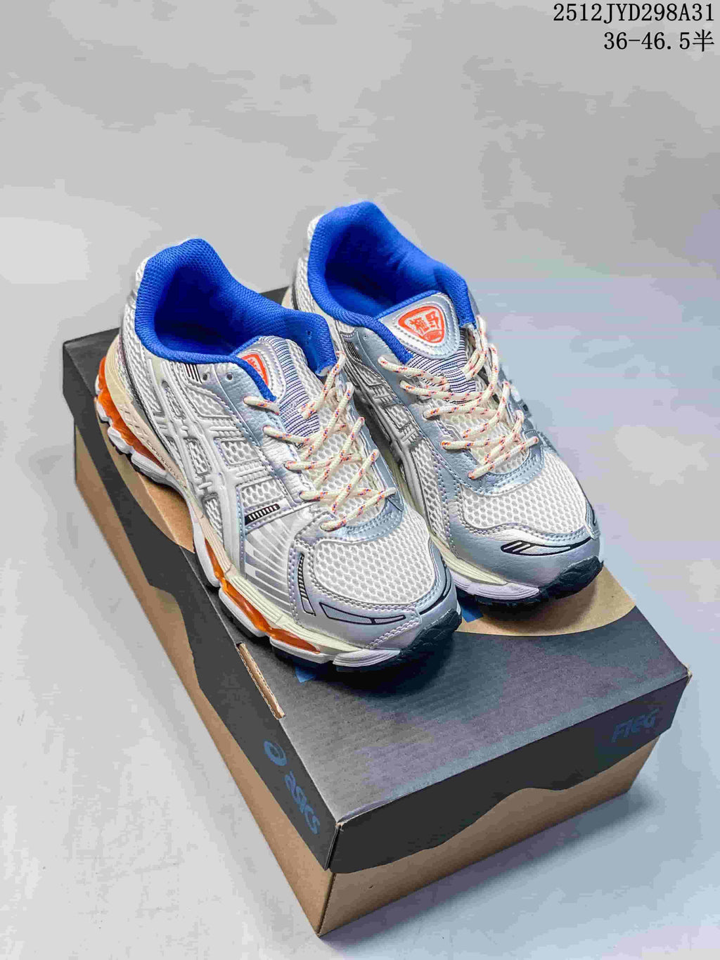 Three ASICS-style running sneakers shown from the side in silver, white and pale aqua colorways.