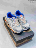 Three ASICS-style running sneakers shown from the side in silver, white and pale aqua colorways.