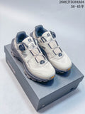 Pair of light-colored Kailas FUGA EX3 BOA trail shoes with dark gray accents, shown on a shoe box.