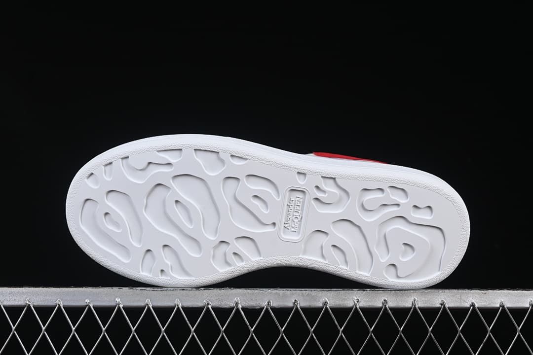 Underside view of the white outsole with molded tread pattern.