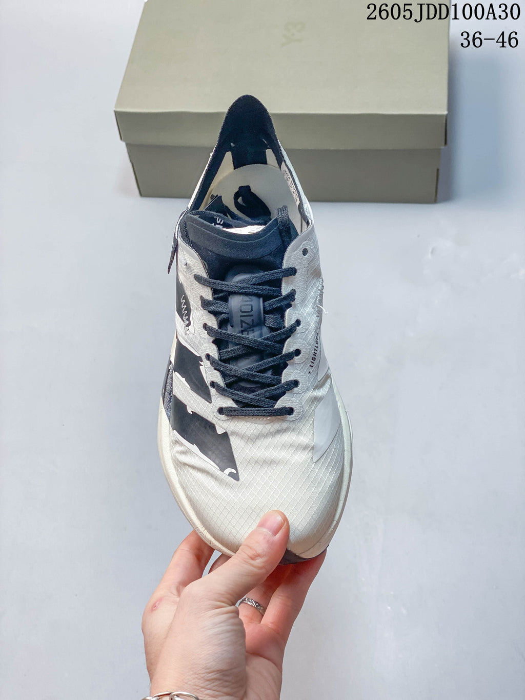 Top view of the running shoe showing its laces and patterned upper