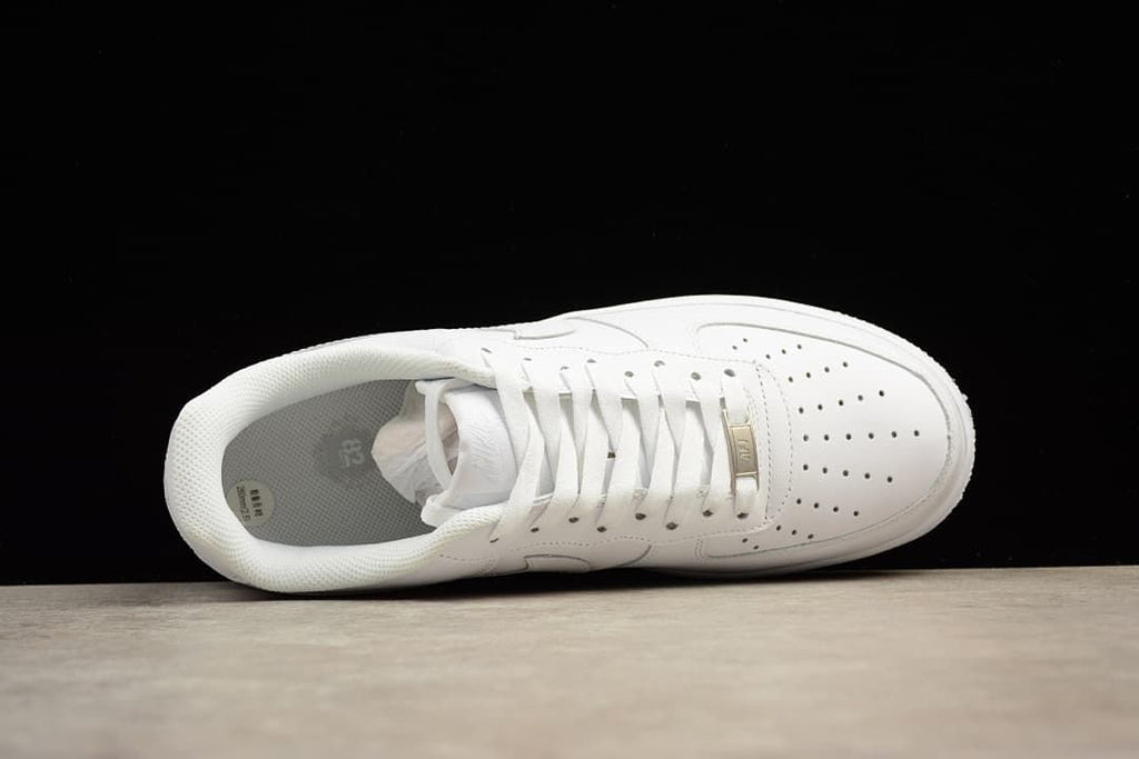 Top-down view of a white lace-up sneaker.