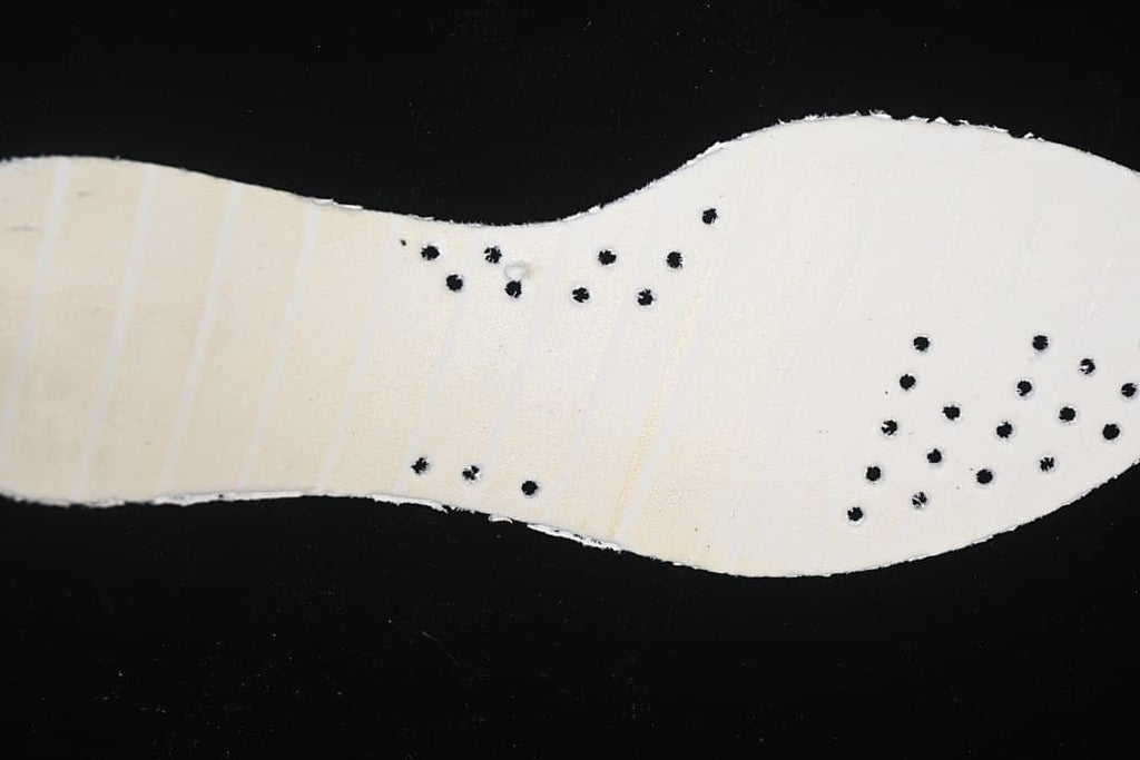 Underside view of the white shoe insole