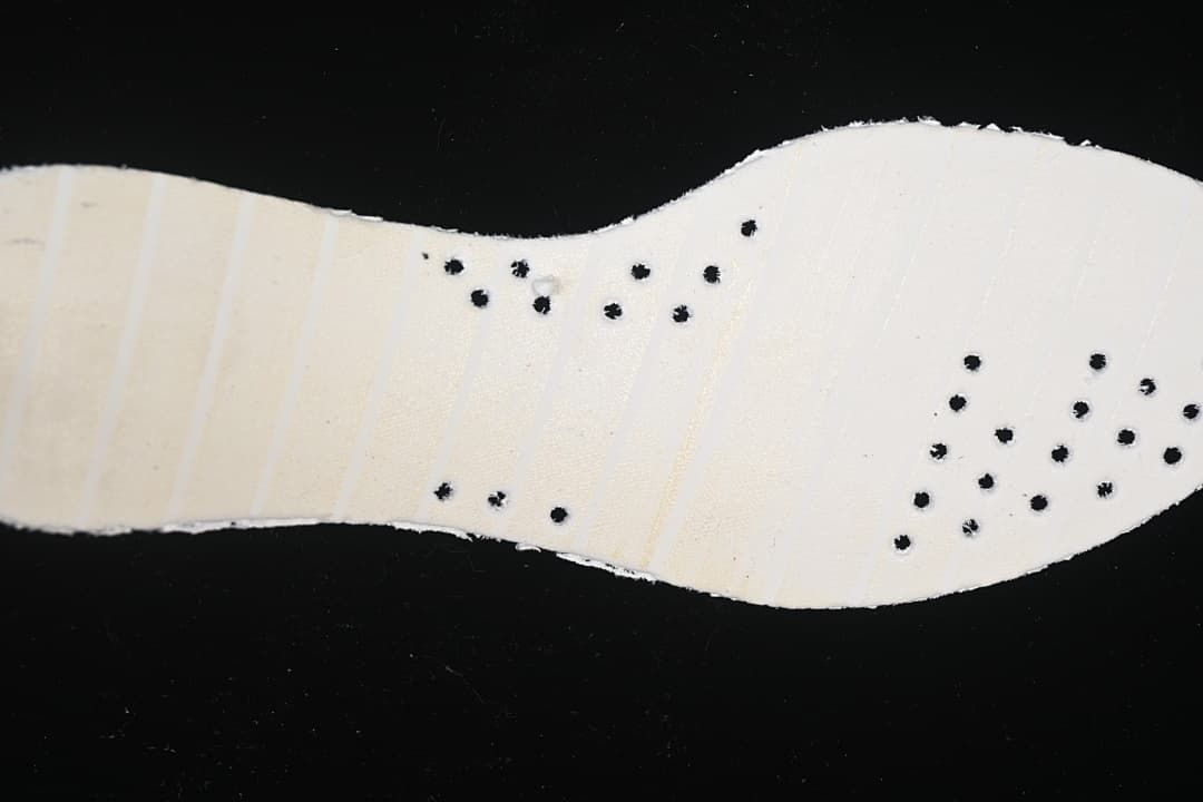 Underside view of the white shoe insole