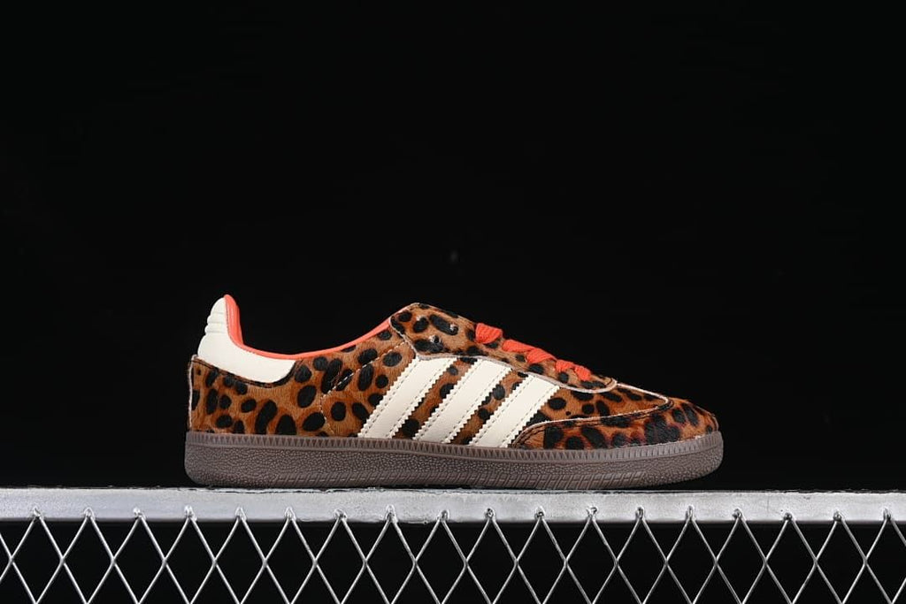 Side view of the sneaker highlighting the leopard print, cream stripes, and brown outsole