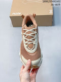 Top view of a brown and cream low-top sneaker with layered laces, mesh panels, and a white toe bumper.