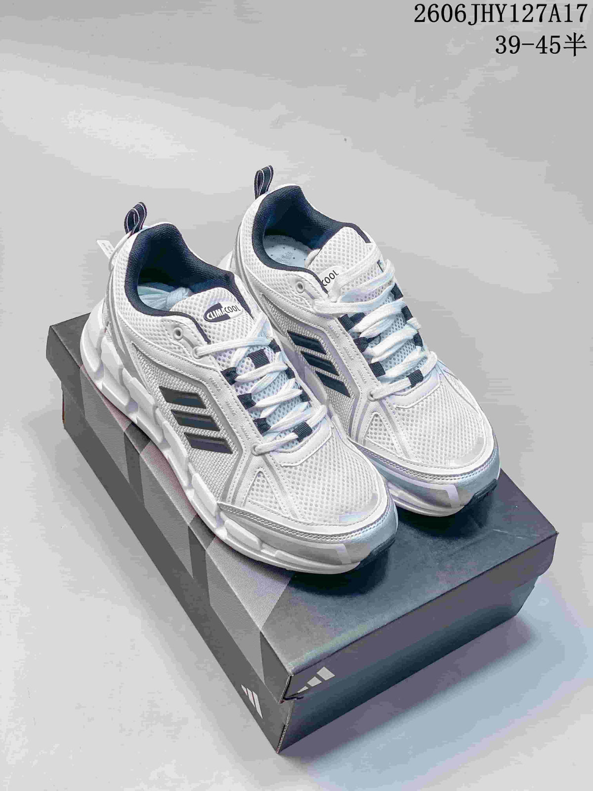 Pair of white Adidas Climacool Ventage shoes viewed from the front and side, with dark accents and chunky soles.