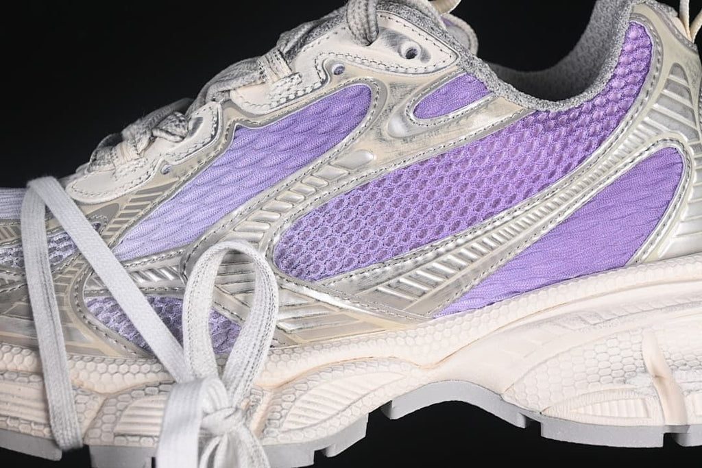 Close-up of lilac mesh panels and metallic-tone overlays.