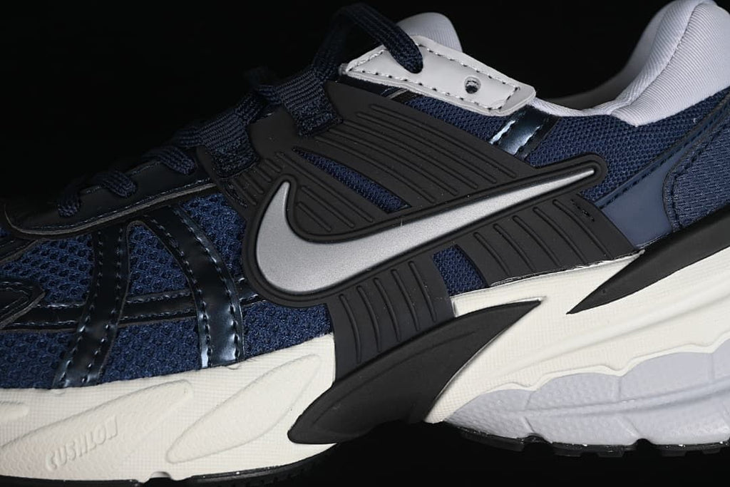 Close-up of the side Swoosh, layered panels and sculpted midsole