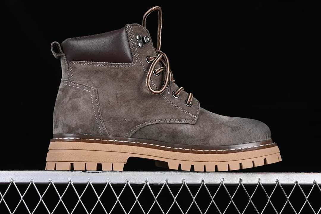 Side profile of a gray TB10076 boot with a padded collar and tan lugged sole.