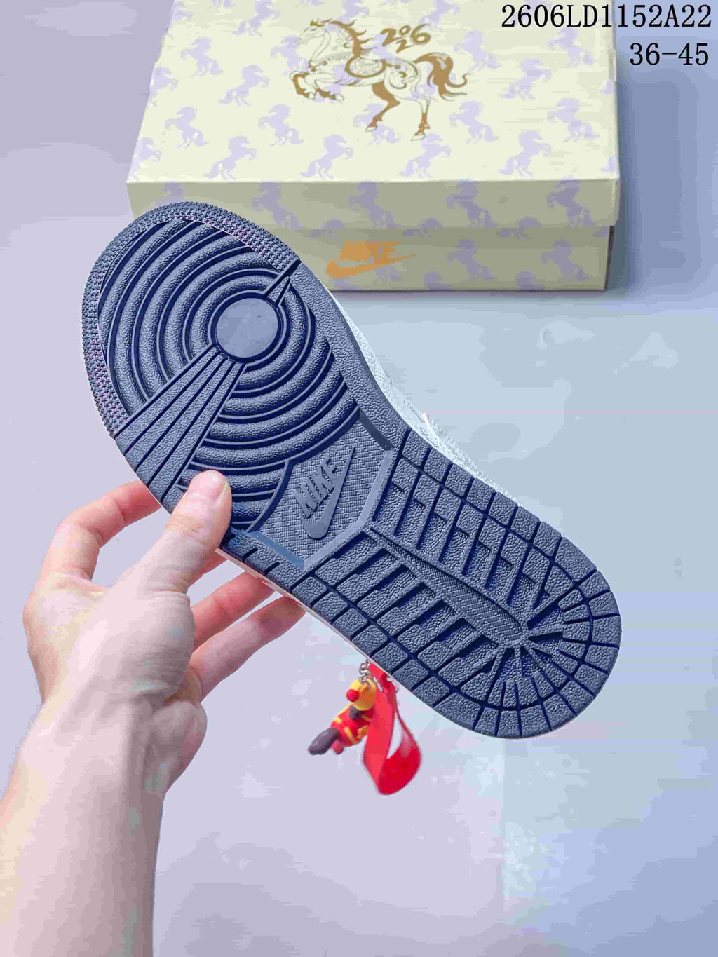 Close-up of the dark navy patterned outsole on a Jordan Air Jordan 1 Low sneaker.