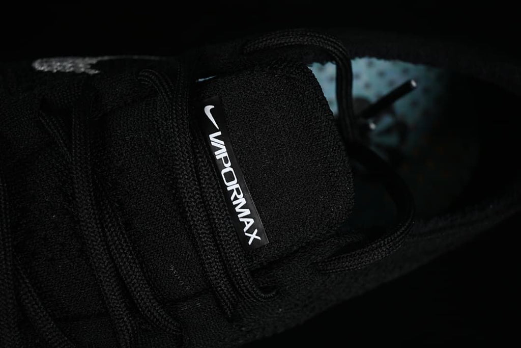 Close-up of the tongue branding and black laces.