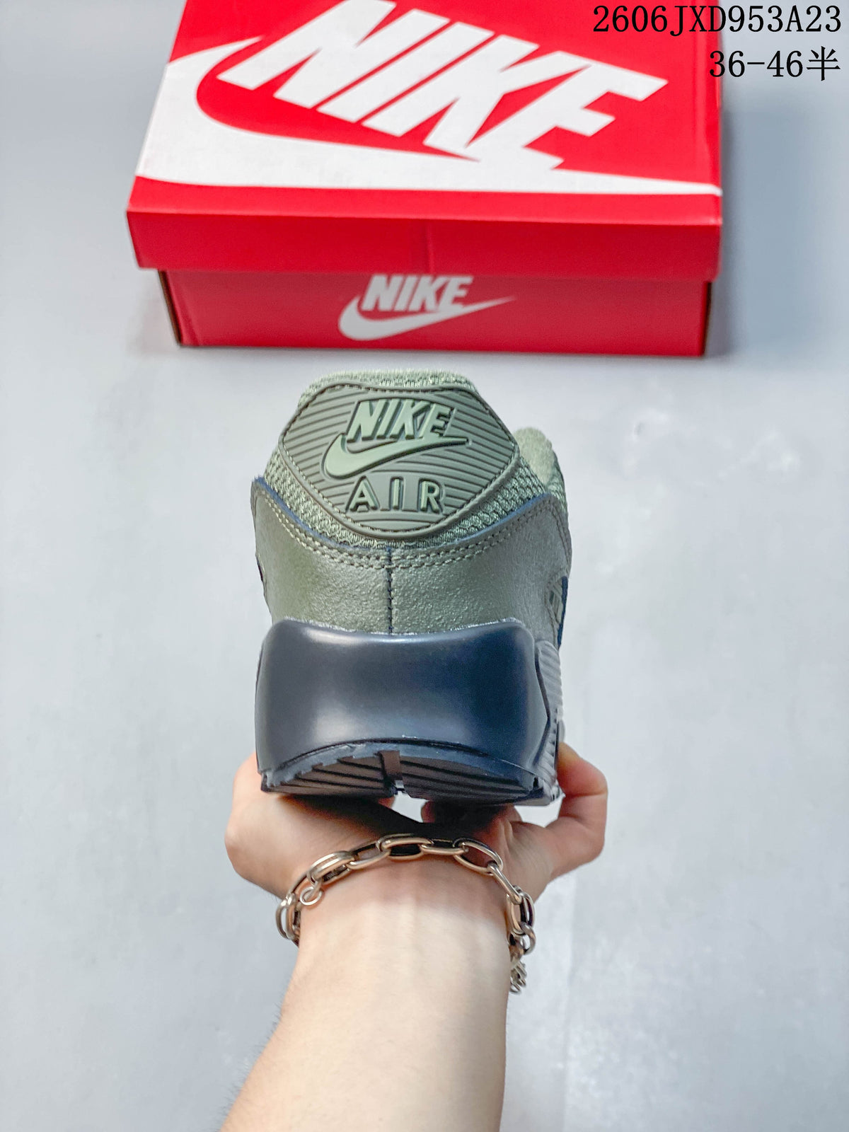 Rear view of the olive green sneaker with Nike Air branding