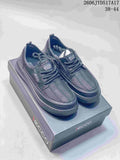 Pair of dark gray ECCO lace-up sneakers displayed on a box; image text states sizes 38–44.
