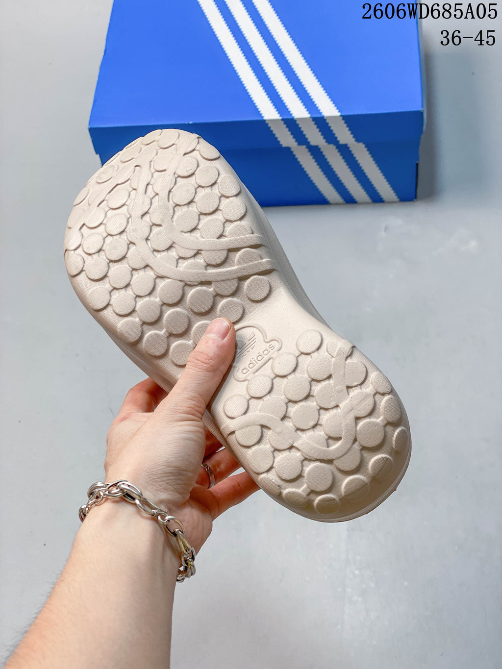 Textured outsole of a light beige adidas AdiFOM Stan Smith Mule clog.