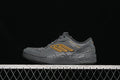 Side view of dark grey Balenciaga Hamptons sneakers with yellow-orange side emblem