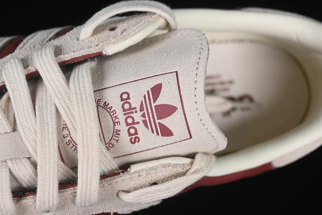 Close-up of the tongue branding and cream laces