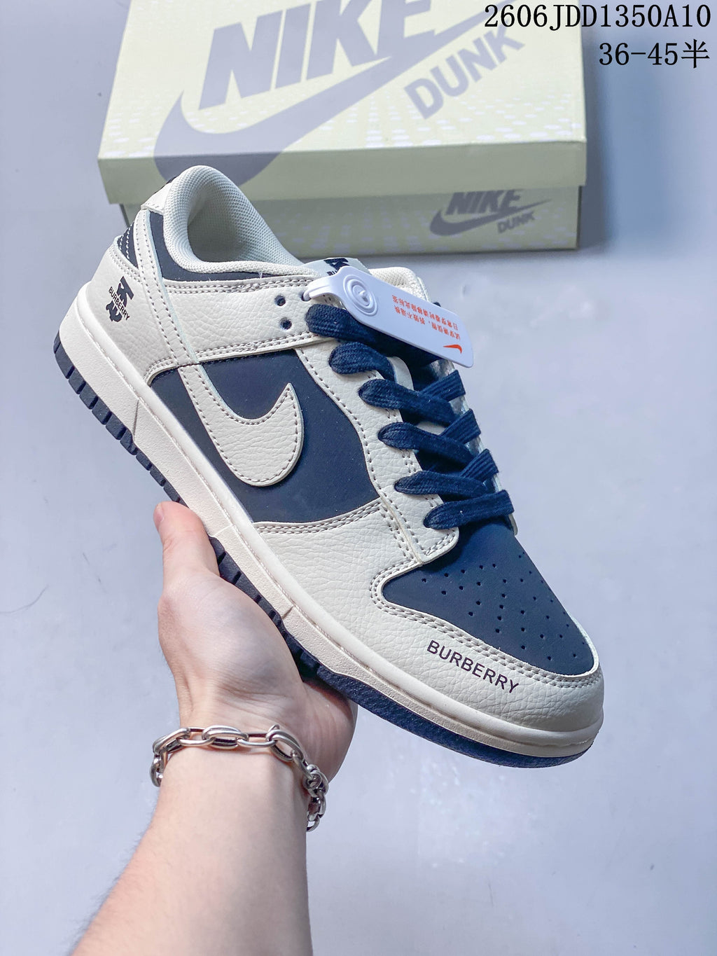 Angled side view of the navy and off-white sneaker with visible branding
