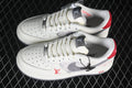 Pair of off-white low-top sneakers with gray patterned panels, gray Swooshes, and red accents