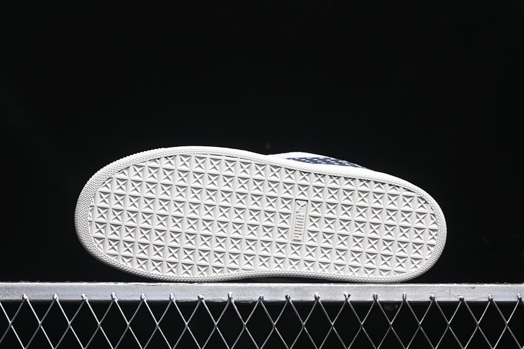 Underside view showing the patterned rubber outsole.