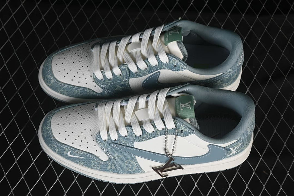 Top view of a pair of white and blue Jordan 1 Low sneakers with patterned panels and white laces