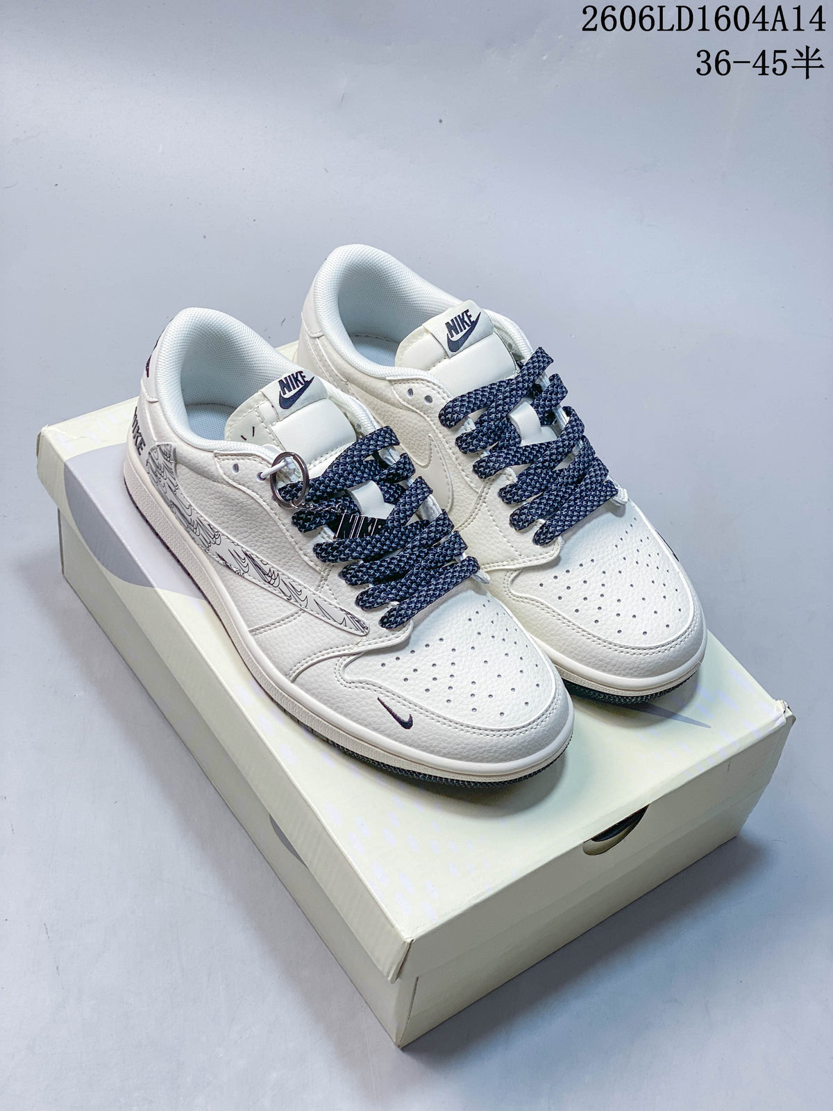 Pair of white sneakers with navy patterned laces and graphic side overlays