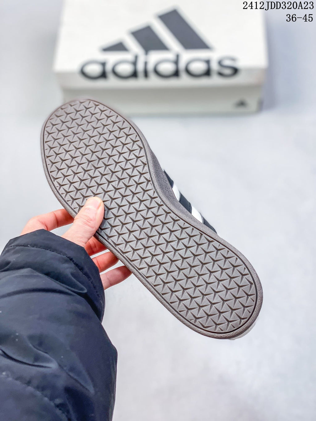 Close-up of the sneaker outsole with a repeating geometric tread pattern