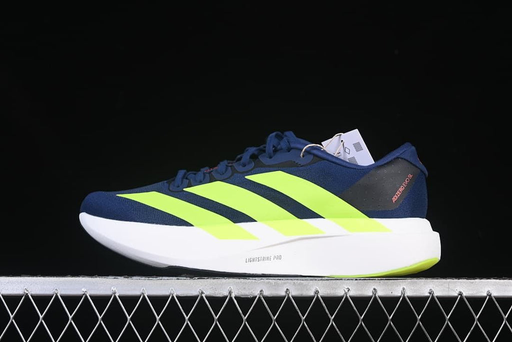 Side view of navy Adidas Adizero Evo SL running shoes with lime stripes and a white midsole.