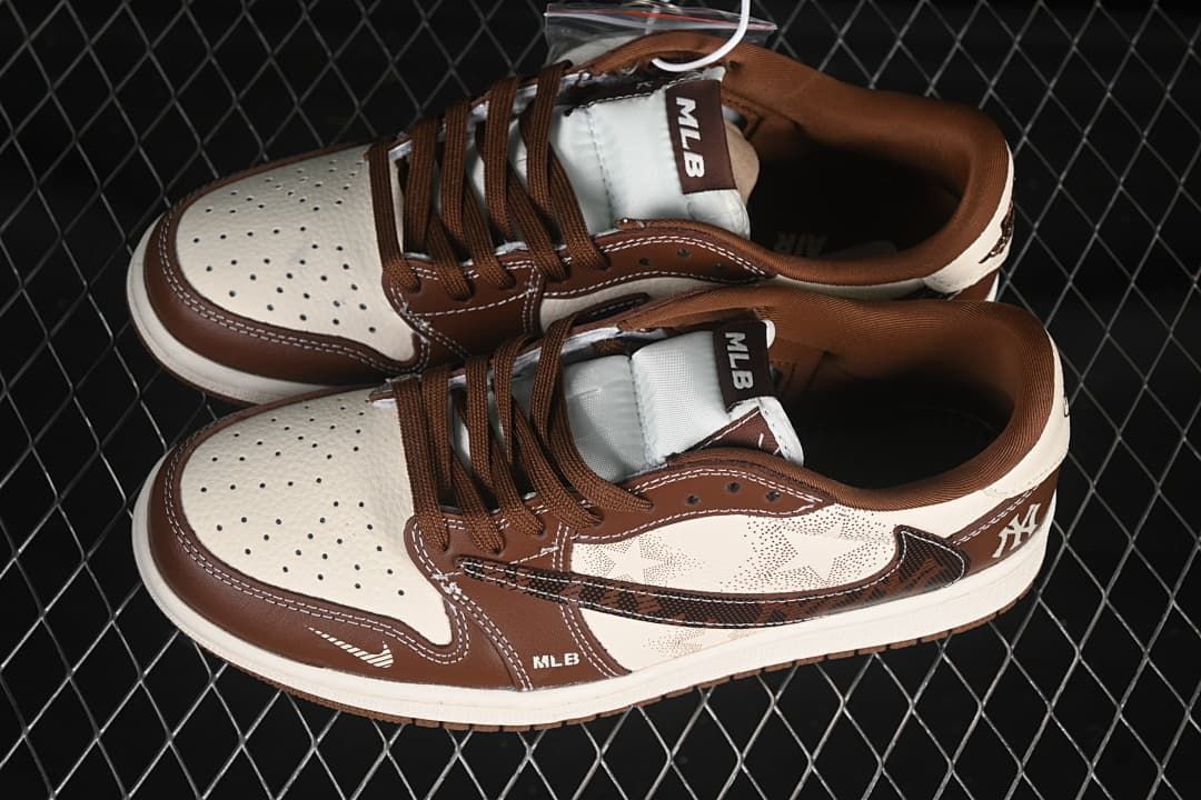 Pair of brown and off-white low-top sneakers viewed from above, showing laces and MLB tongue labels