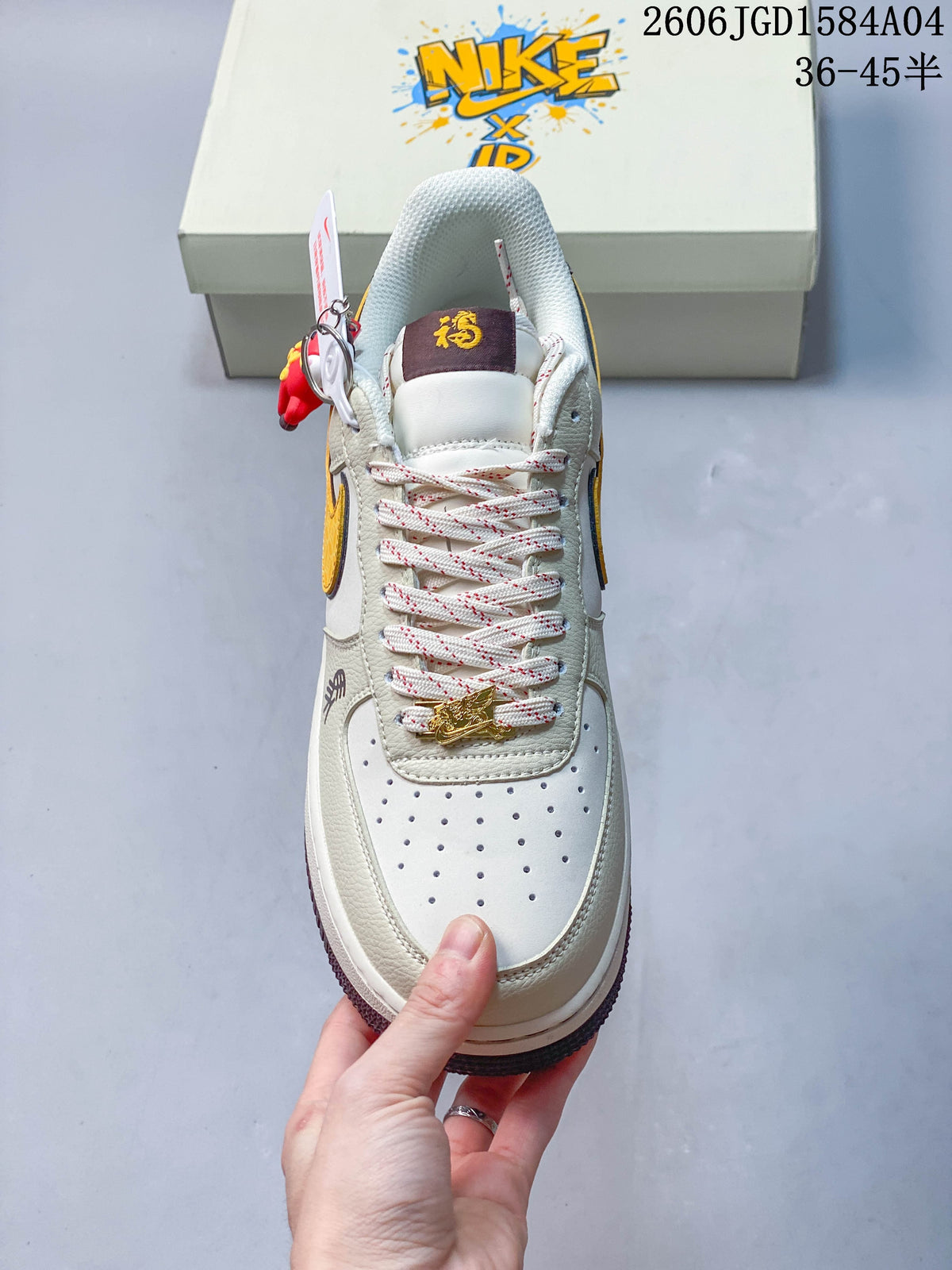 Top view showing perforated toe, patterned laces, and decorative lace charm