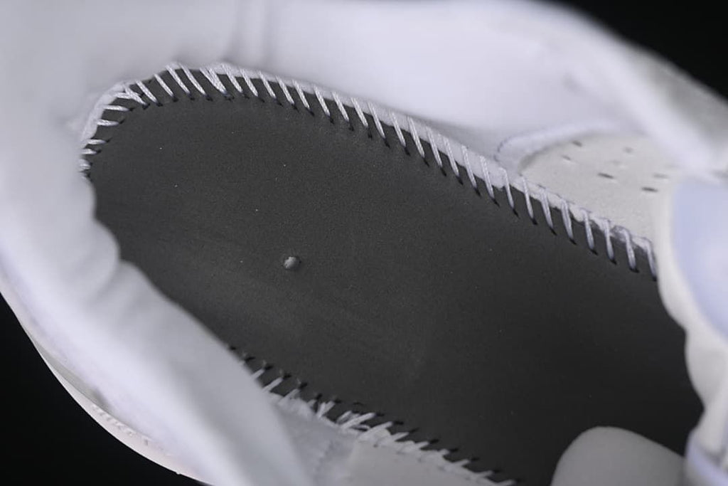 Close-up view inside the shoe around the insole and lining.