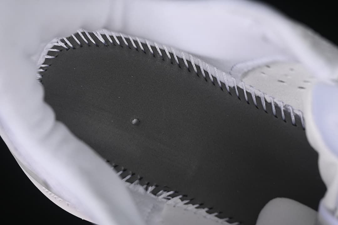 Close-up view inside the shoe around the insole and lining.