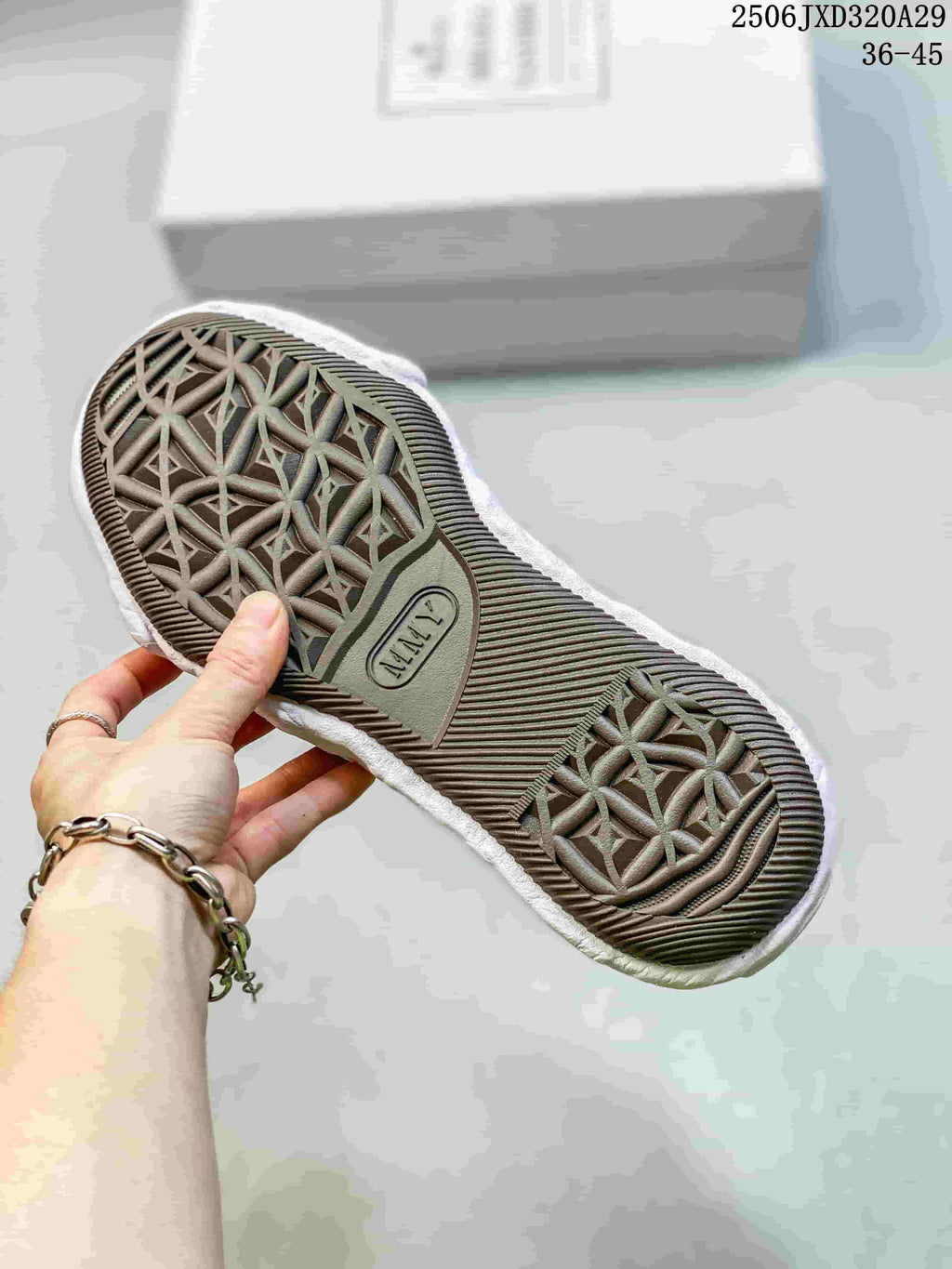 Close-up of the sneaker outsole showing a geometric tread pattern