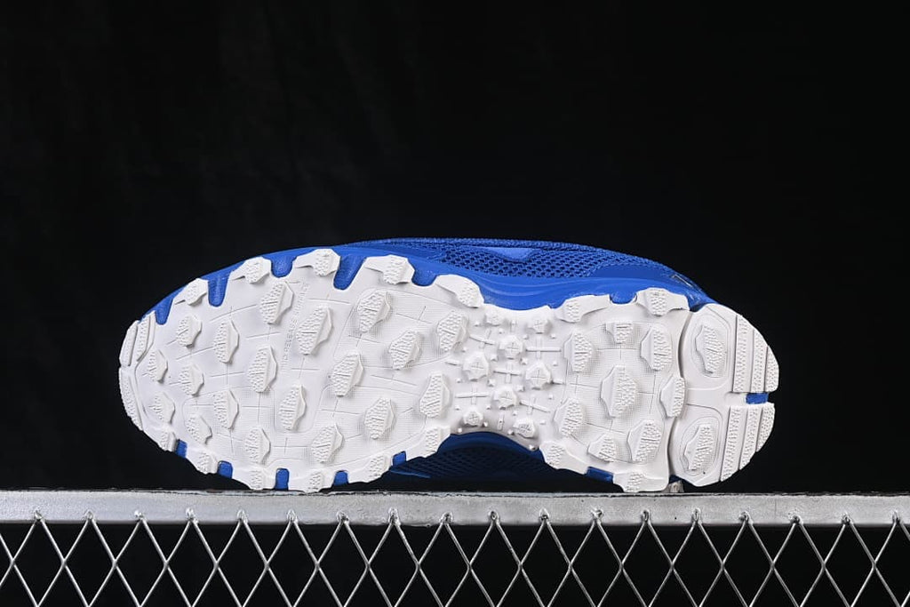 Underside view of the white lugged outsole