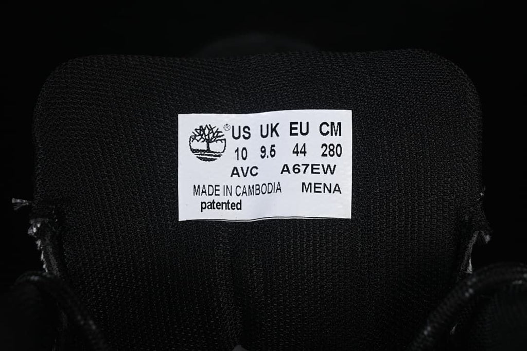 Boot tongue label with Timberland branding and a sample size marking.