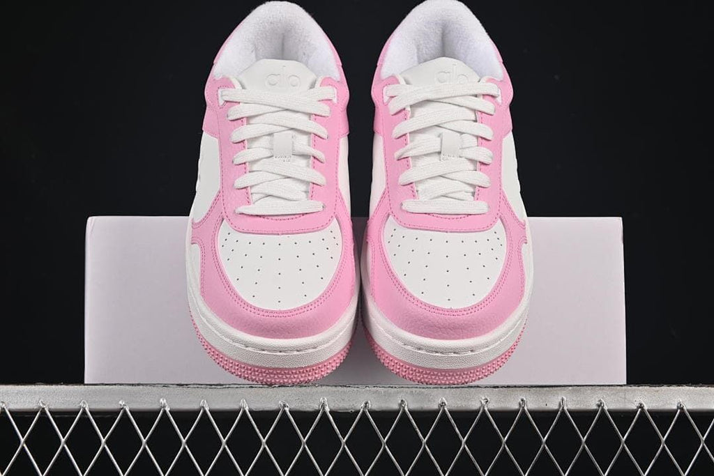 Front view of the pair showing perforated toe panels and white laces