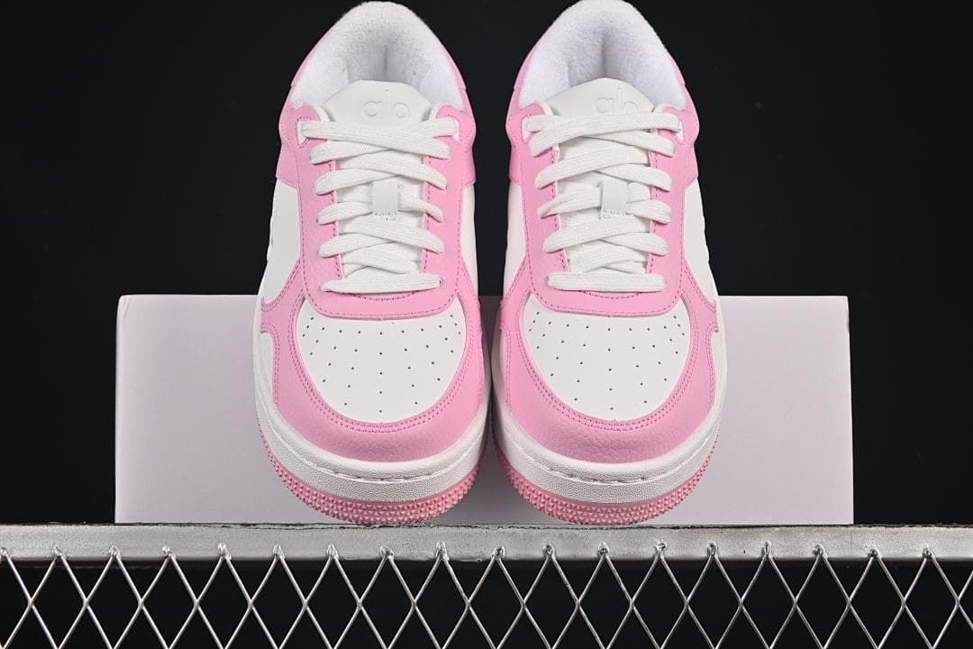 Front view of the pair showing perforated toe panels and white laces