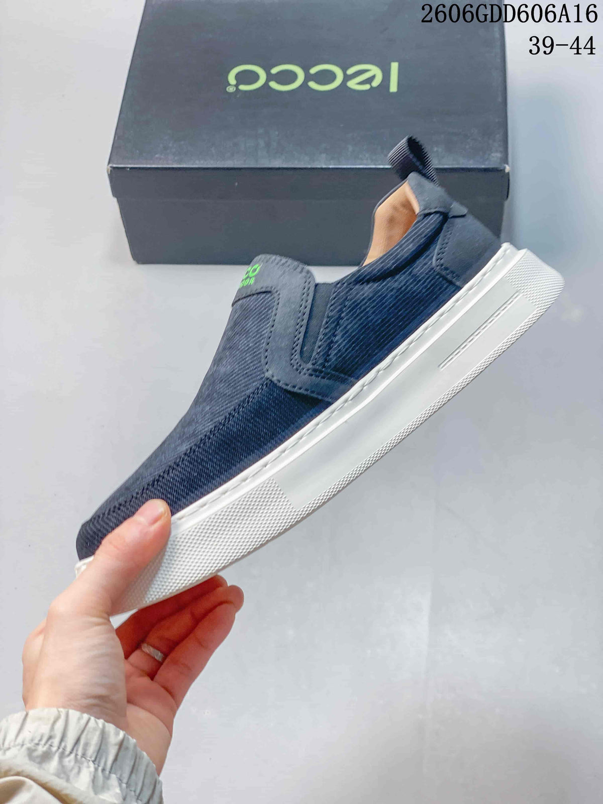 Side view of a navy slip-on sneaker with a white sole